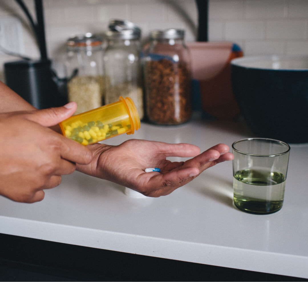 Pouring out medicine from a bottle