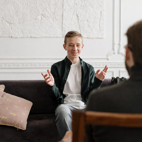 A man talking to a professional about feelings